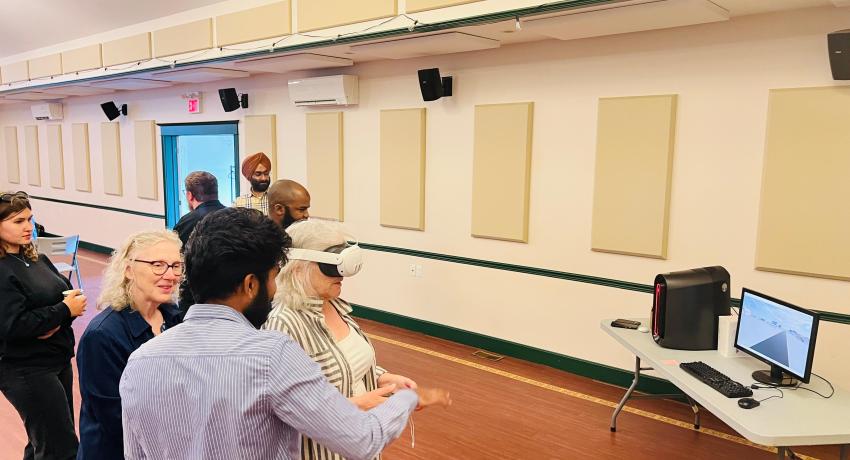UPEI students discussing net zero project with residents